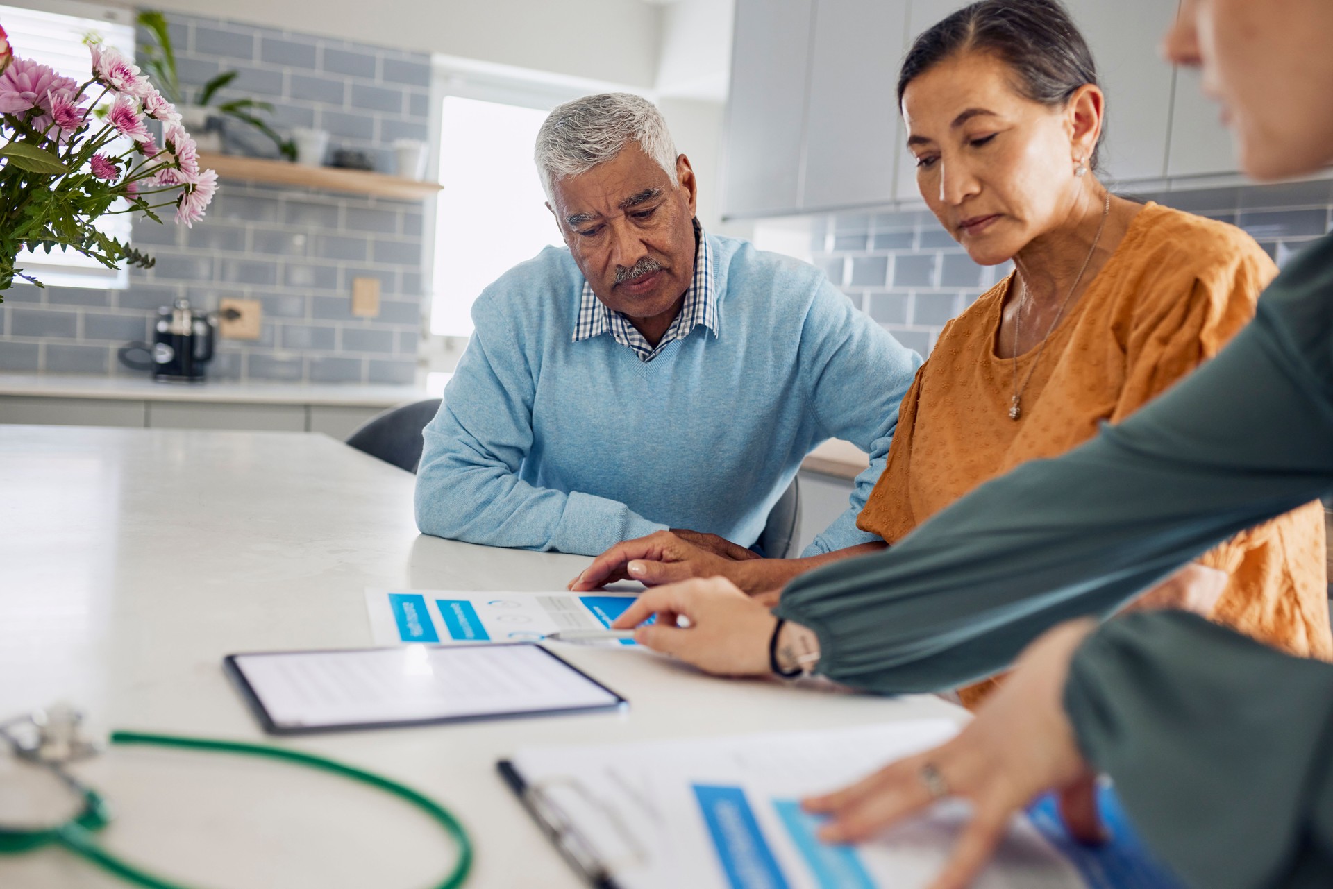 Couple Discussing Healthcare Plan With Doctor